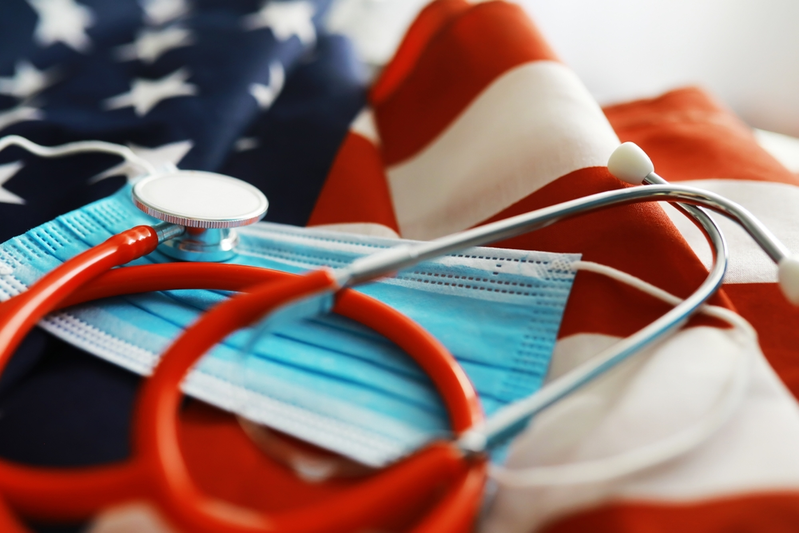 American flag with mask and stethoscope