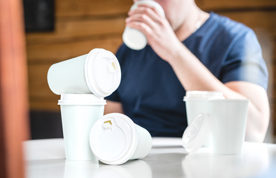 coffee cups scattered on table