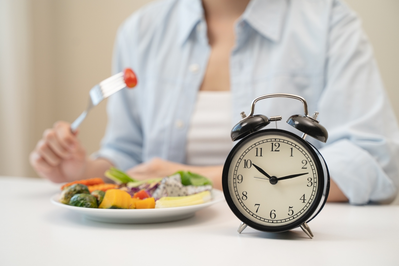 woman eating at a specific time on the clock