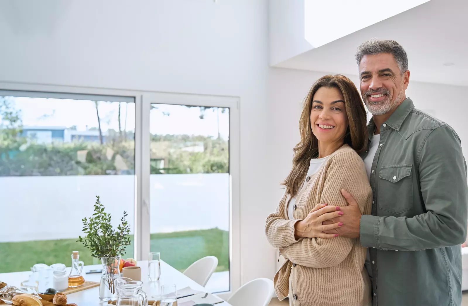 smiling couple in home