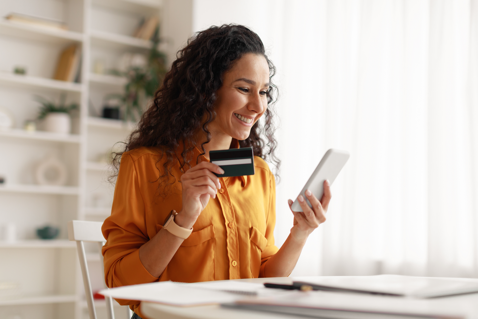 woman paying on her phone