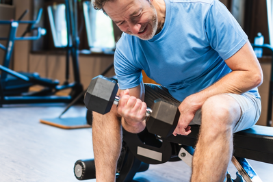 lifting weights as part of a strength training regimen