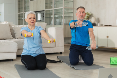 older couple lifting weights