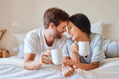 happy couple in bed