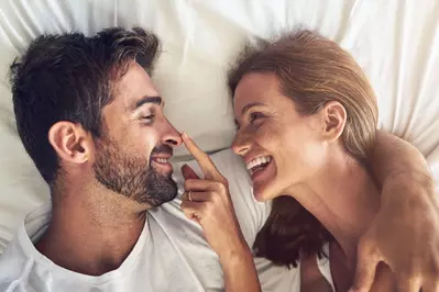 happy couple in bed